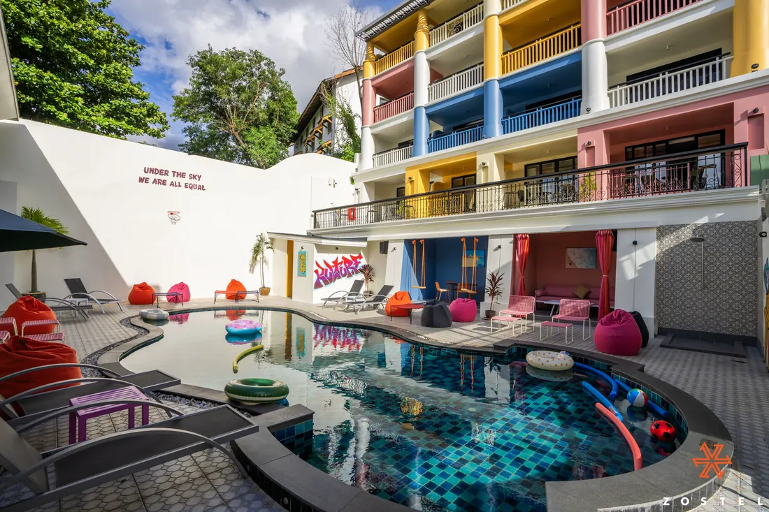 The pool by day, bean bags around the water