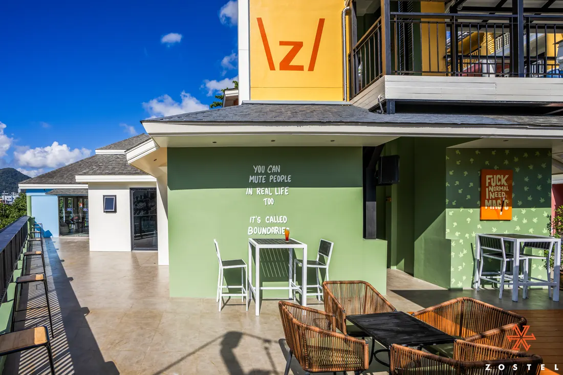 Green terrace bar with wall lettering