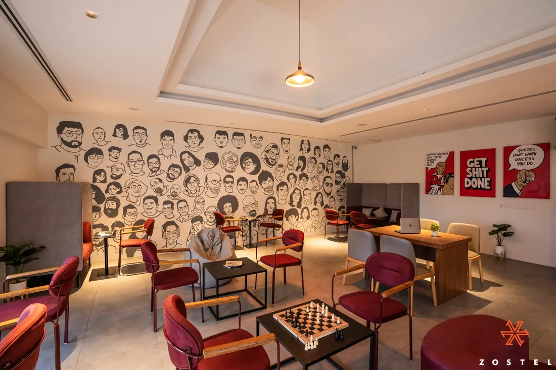 Workation room, one wall covered in hand-drawn faces
